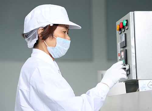 worker operating a uv dryer