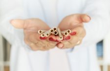 woman holding paper eco friendly drinking straw