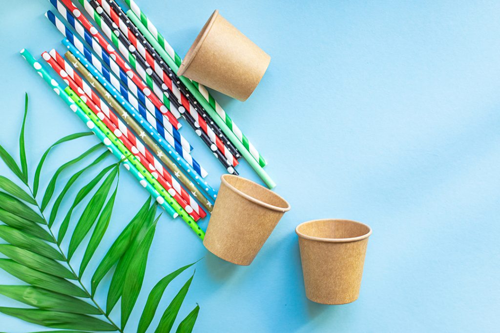 paper-cups-cocktail-straws-striped-dotted-mixed-straws-scattered-flat-lay-useful-ecology-biodegradable-disposable-tableware