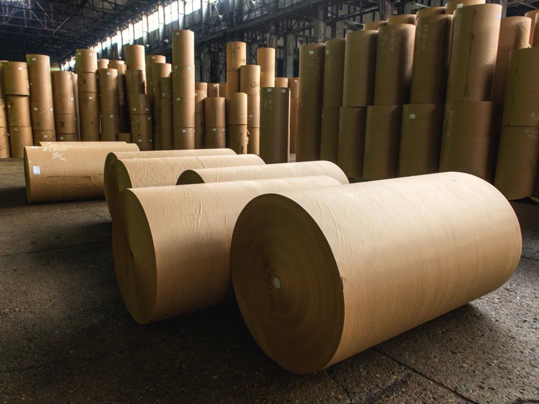 A roll of FSC certified kraft paper in a factory setting