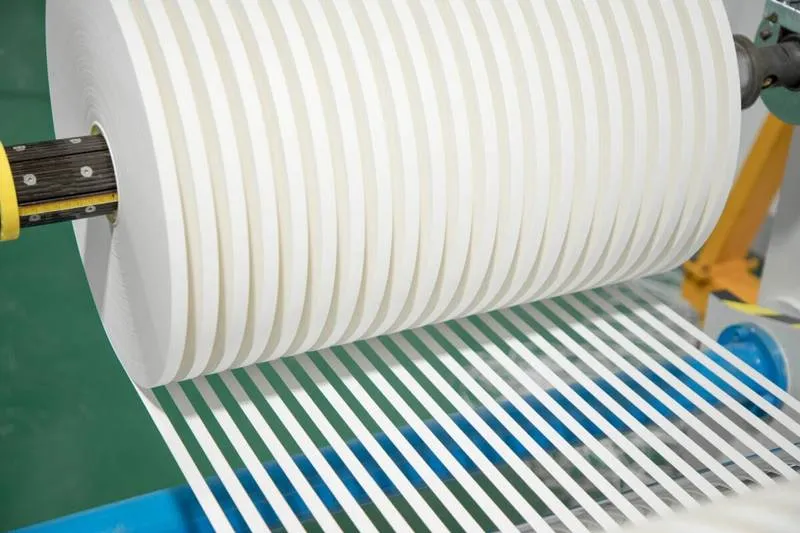 close-up of precisely slit paper bobbins ready for a straw forming machine
