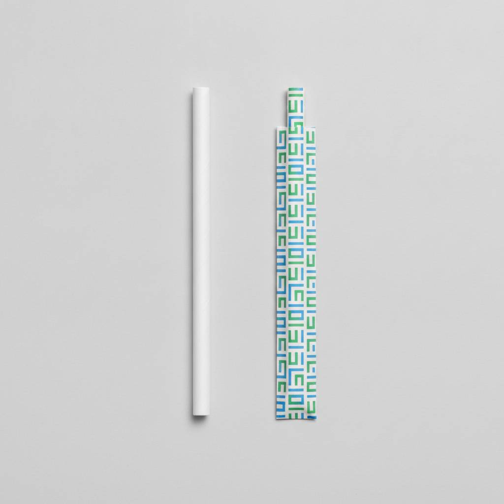 A standard white paper straw next to a custom-printed paper straw with individual wrapping to show the difference in complexity.