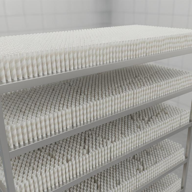 Paper straws neatly arranged on drying racks in a temperature-controlled room.