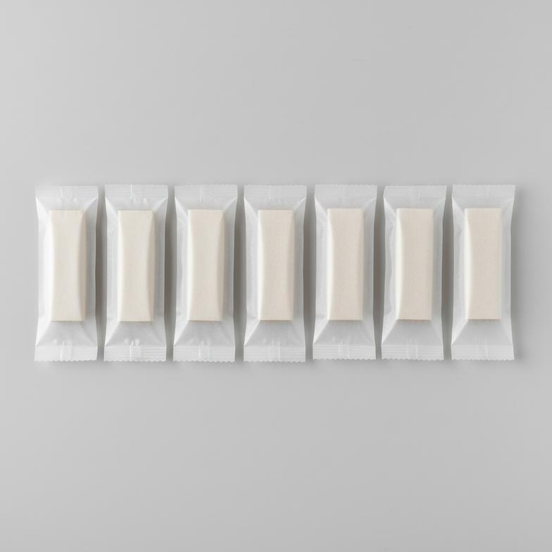 A row of individually wrapped paper breathalyzer mouthpieces ready for professional testing
