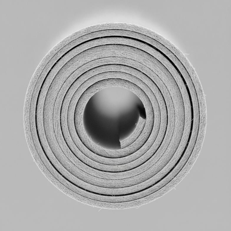 Close-up cross-section of a multi-ply paper breathalyzer mouthpiece showing its sturdy construction