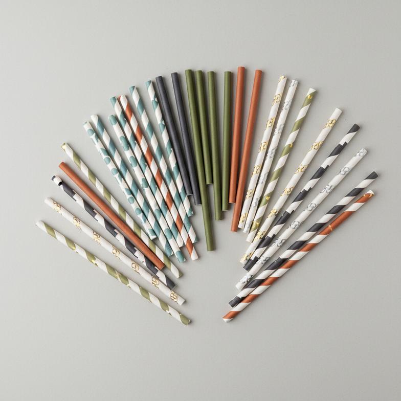 Custom branded paper straws with a company logo printed on them