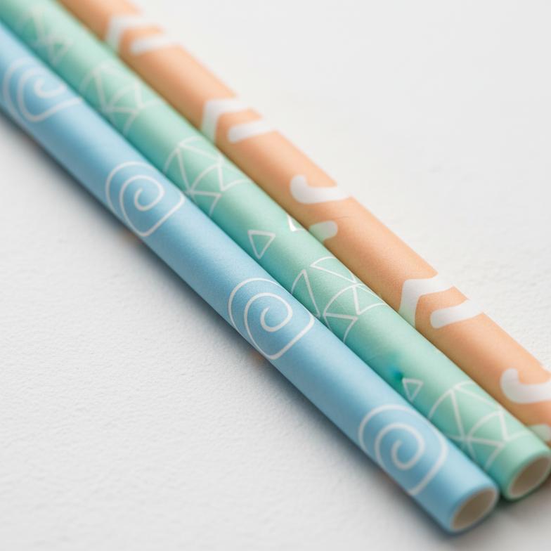 Custom-branded cocktail paper straws with a company logo printed on them