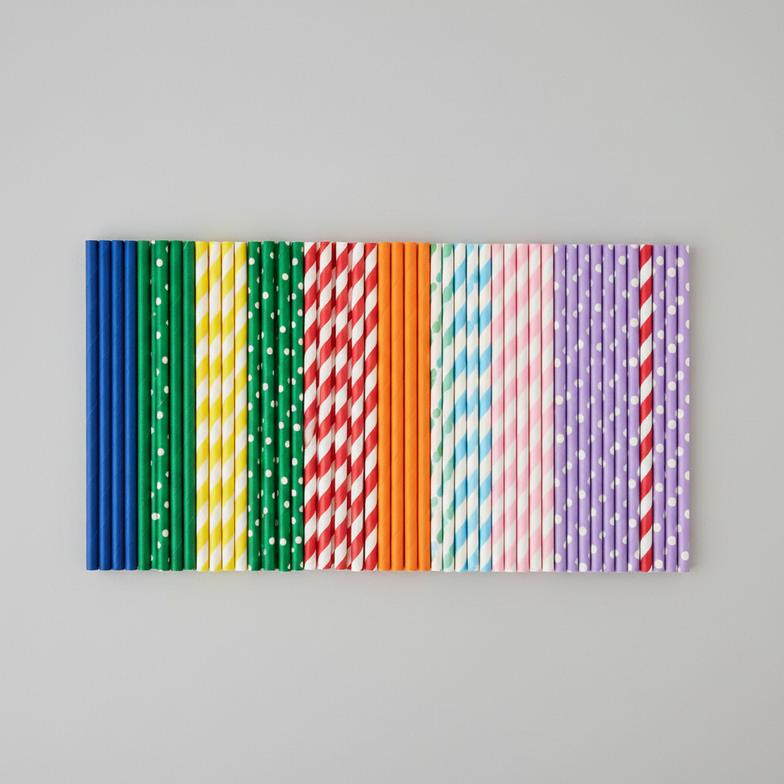 A close-up of various colored paper straws, showcasing different patterns and hues.