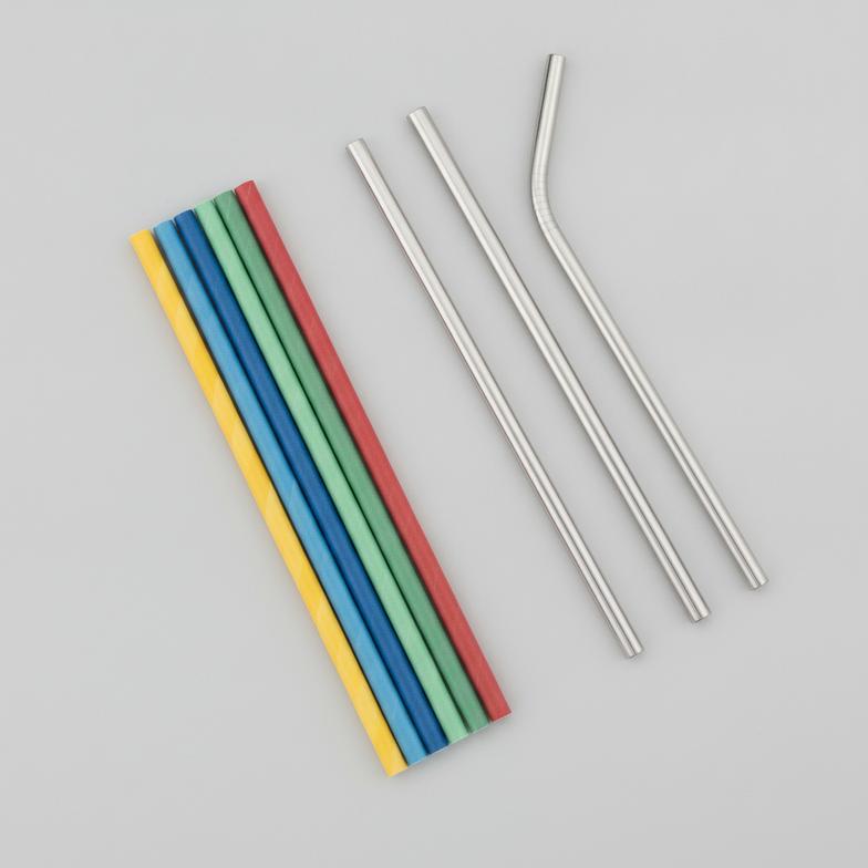 A side-by-side comparison of colorful paper straws versus sleek metal straws for foodservice operations.
