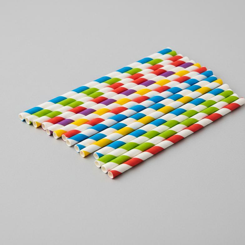 A close-up of colorful printed paper straws, highlighting the quality of the water-based ink.