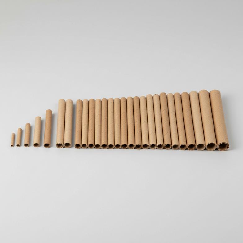 A variety of paper mason bee tubes in different sizes.