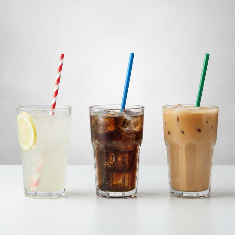 A collection of durable paper straws for acidic, carbonated, and iced beverages being used in lemonade, soda, and iced coffee.