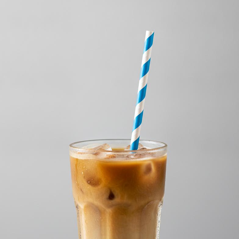 A high-quality paper straw showing excellent paper straw stability in an iced coffee.