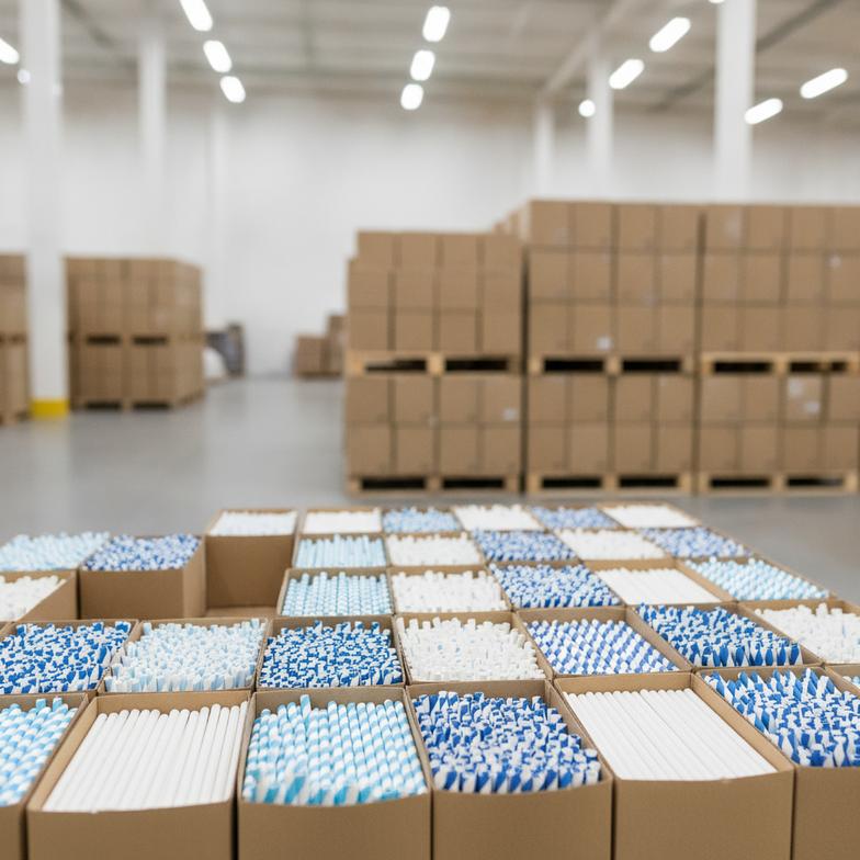 A collection of high-quality paper straws for airlines and cruise lines ready for shipment
