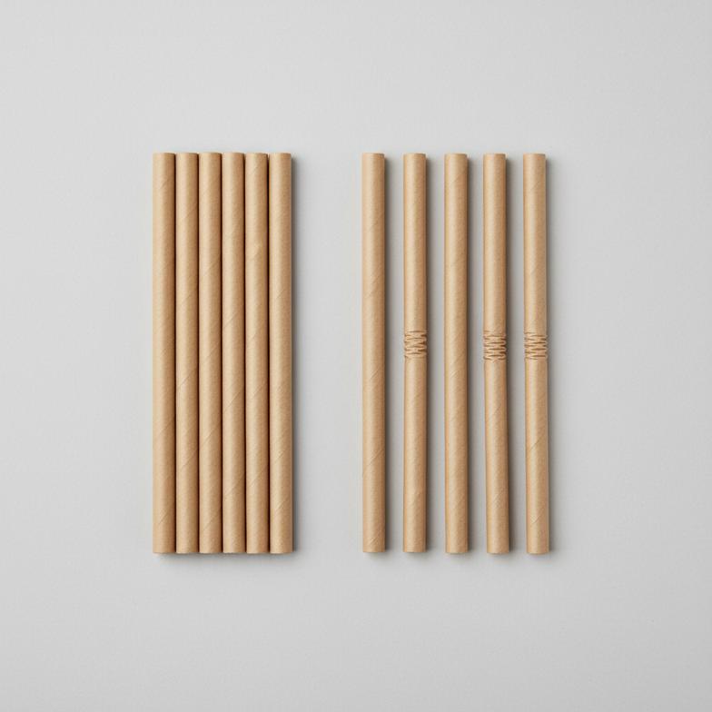 A side-by-side comparison of straight vs bendable paper straws on a table