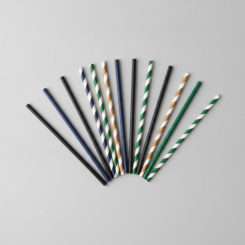 A selection of high-quality paper cocktail straws in different colors and patterns.