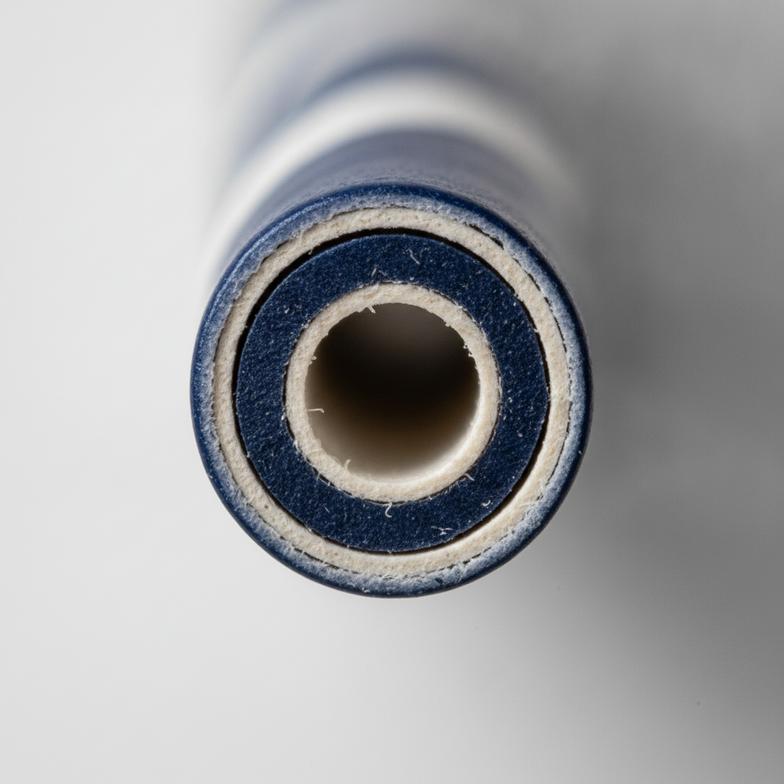 A close-up showing the sturdy construction of a 3-ply paper cocktail straw.